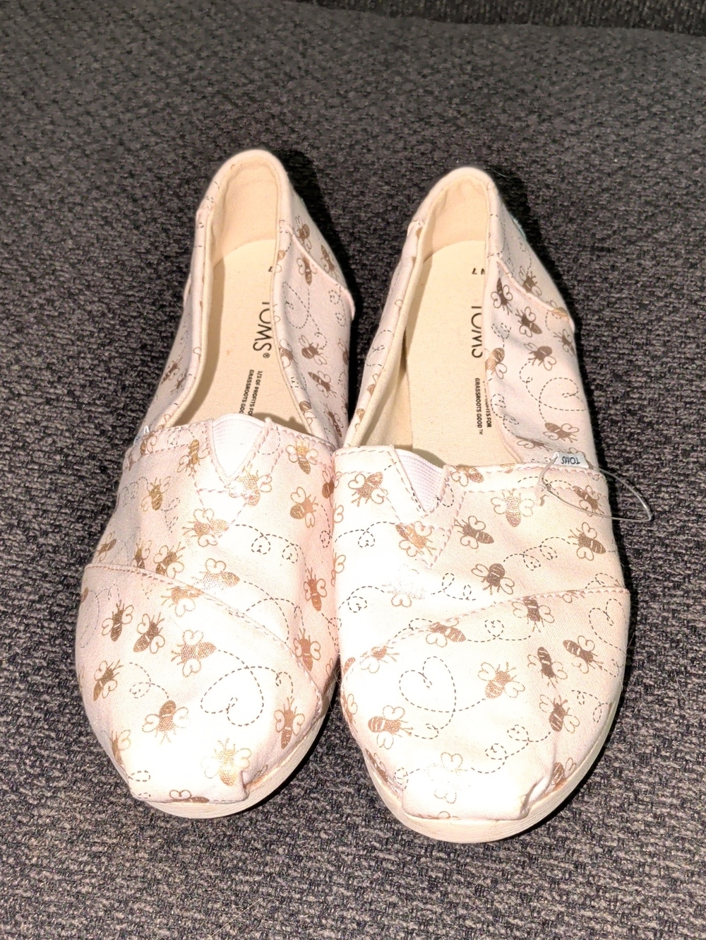 Toms Women's Slip-On Flats in Light Pink with Gold Bee Print